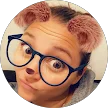 Homeowner profile: Woman wearing glasses and playful dog-ear filter.